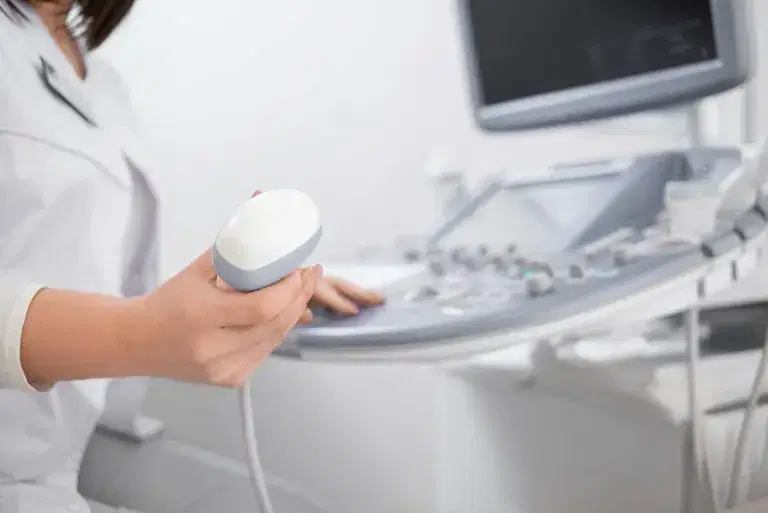 Medical professional using ultrasound machine