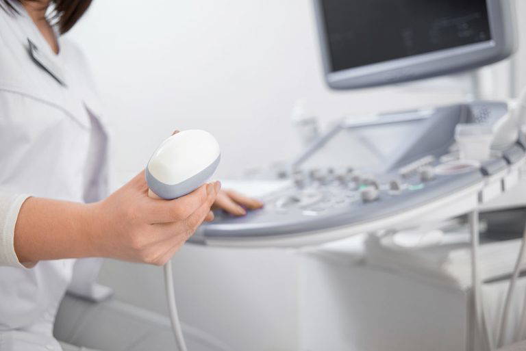 Medical professional using ultrasound machine