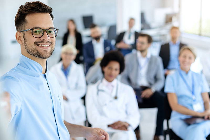 Medical professionals attending a presentation.